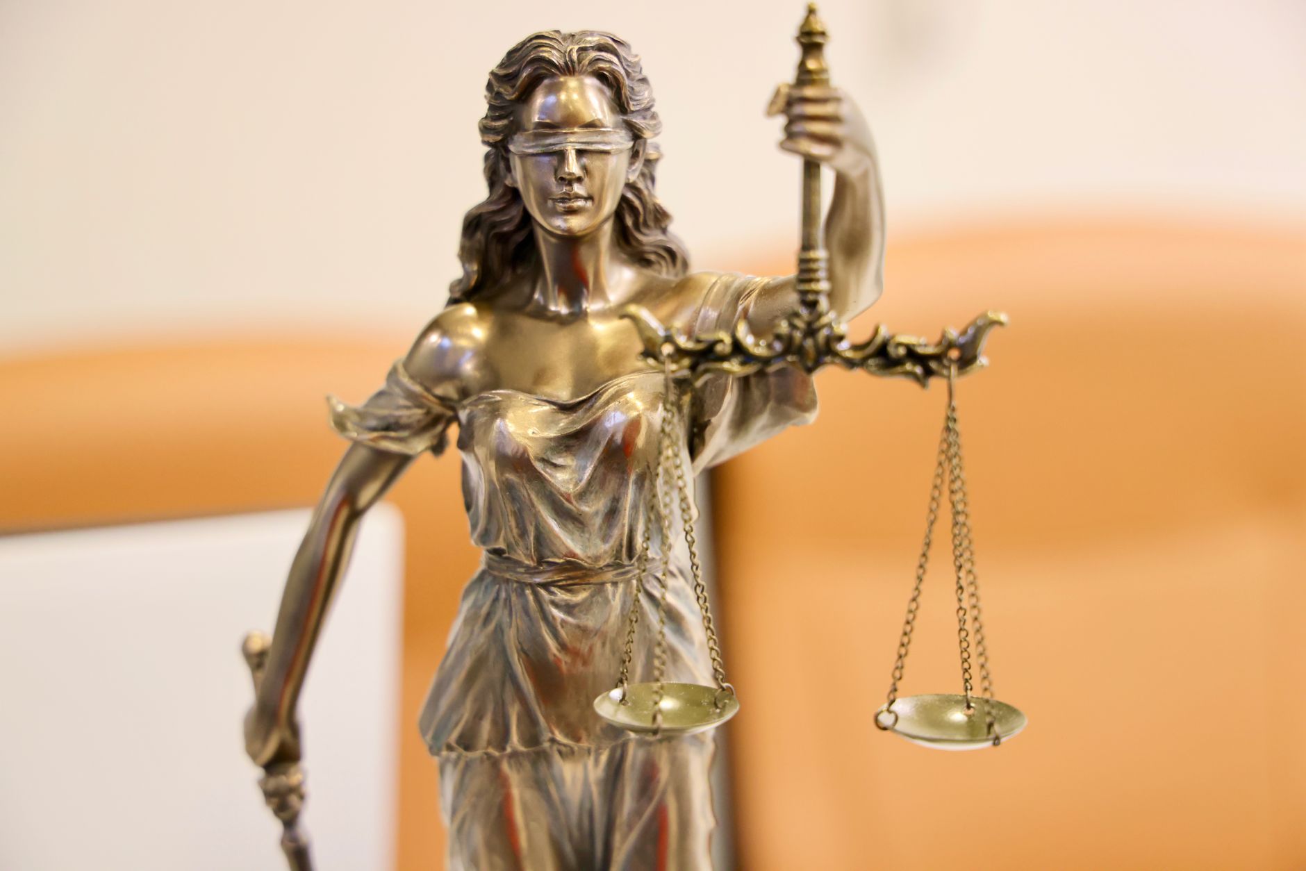 close up of lady justice statue with scales