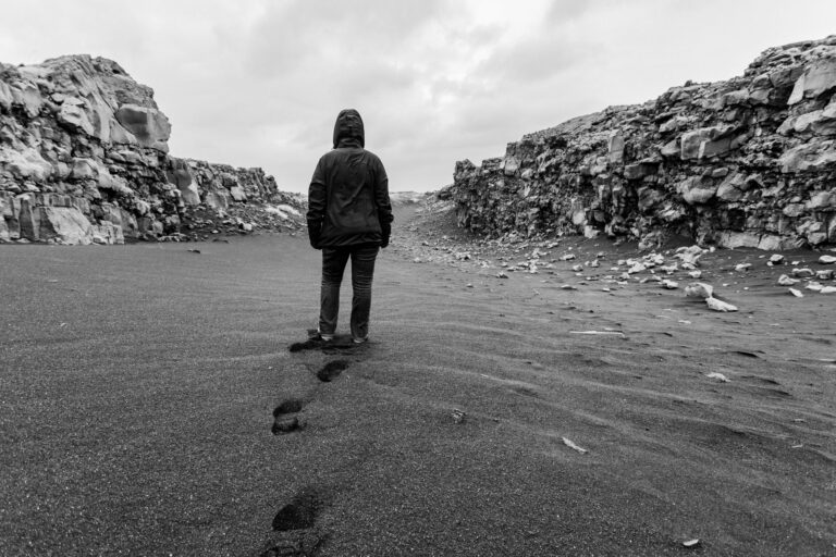 solitary walk through rocky desert landscape